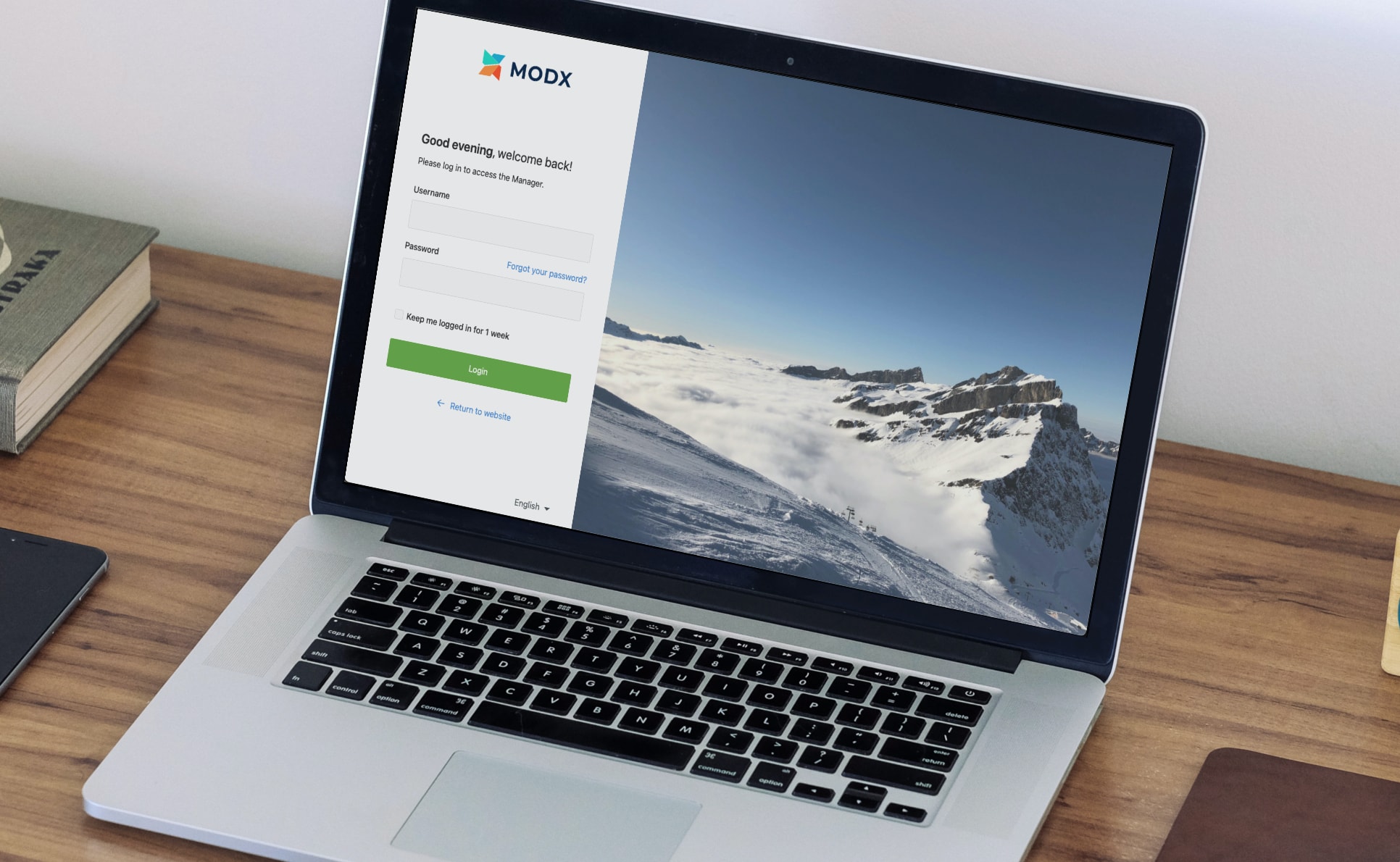 A laptop displaying the new MODX Revolution 3.0 Manager Login screen.