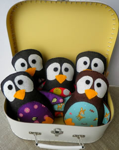 Felt penguins in a suitcase